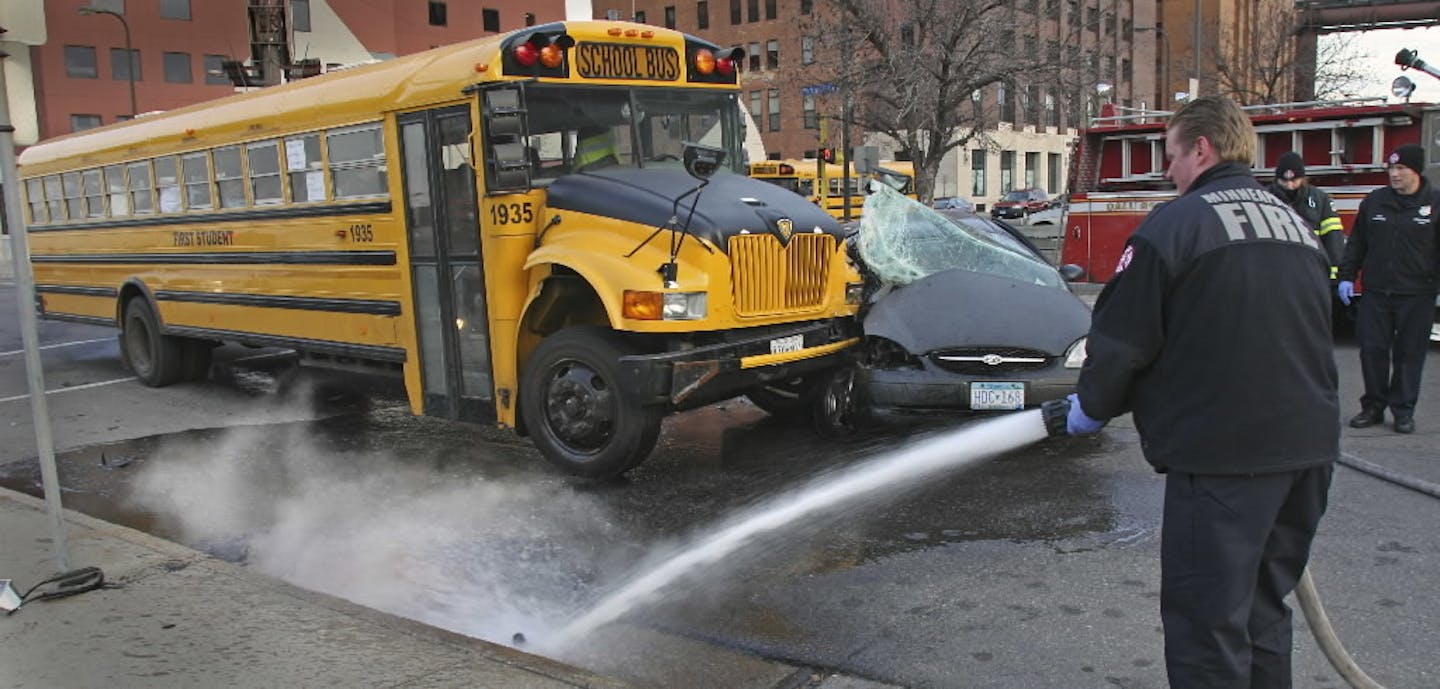 Minneapolis fire, police and Hennepin County paramedics responded to a First Student school bus/car crash in 2007.