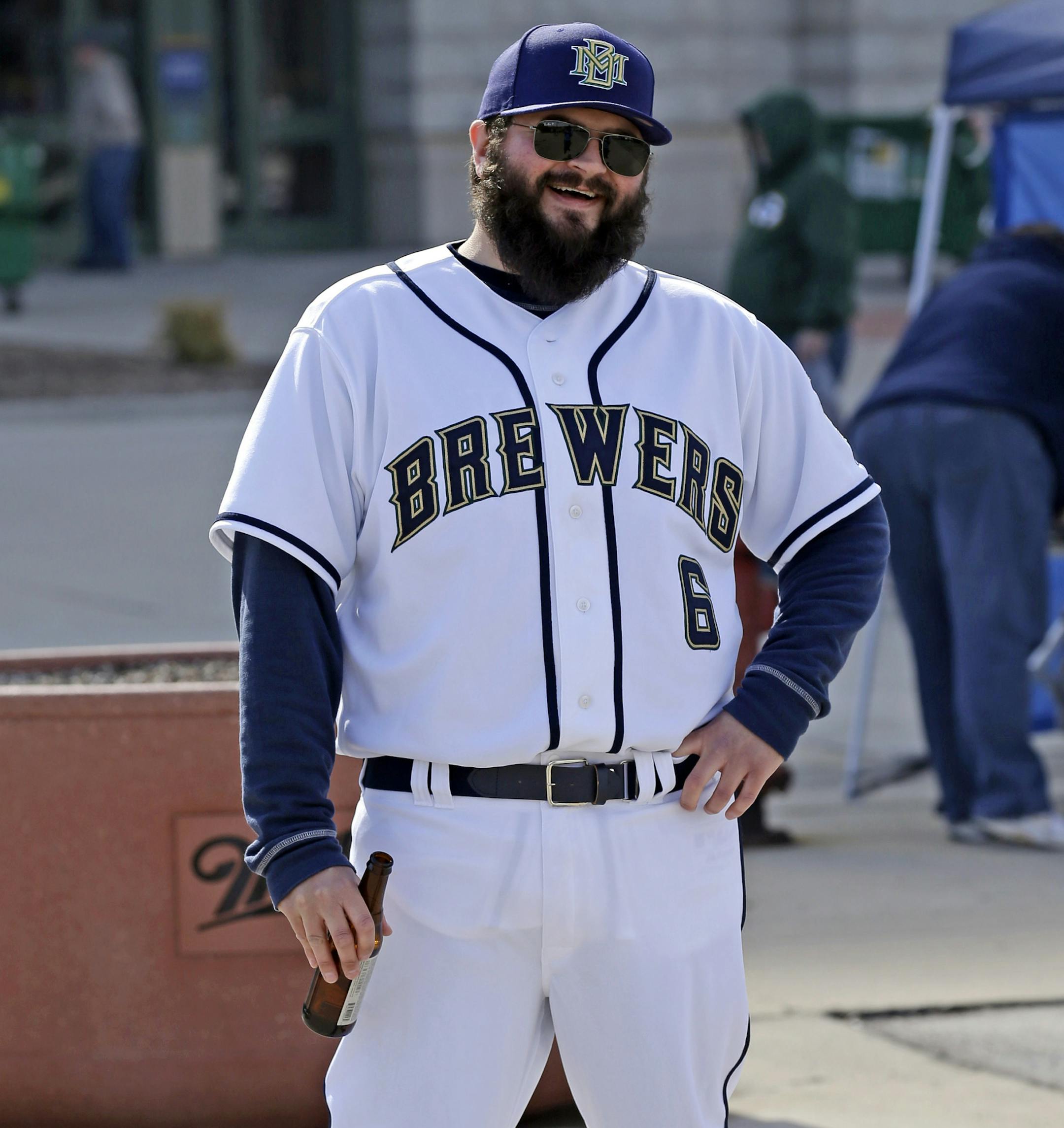 Milwaukee Brewers fan J.J. Hall is decked out in uniform in the parking lot before the opening day baseball game between the Brewers and Atlanta Braves at Miller Park, Monday, March 31, 2014, in Milwaukee. (AP Photo/Jeffrey Phelps)