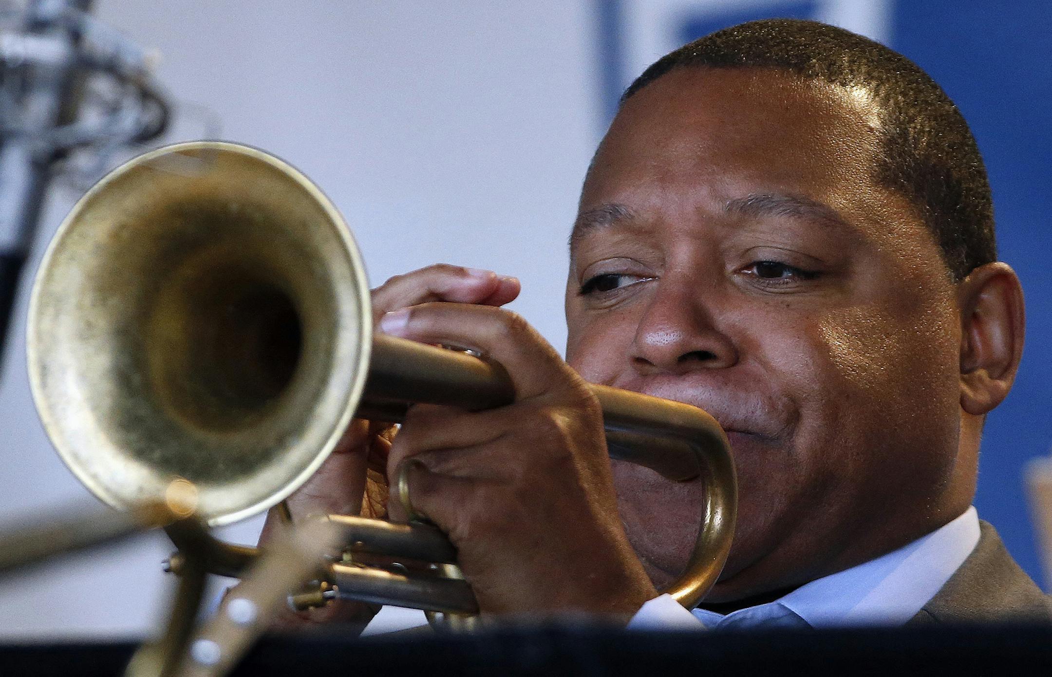 FILE - In this Saturday, Aug. 2, 2014 file photo, Wynton Marsalis performs with Jazz at Lincoln Center Orchestra during the Newport Jazz Festival in Newport, R.I. The Rockefeller Foundation and Jazz at Lincoln Center are teaming up to put jazz in the ears of thousands of urban school children across the globe. The tour, led by Wynton Marsalis, is designed for students with limited access to arts education in grades K-12. (AP Photo/Michael Dwyer, File) ORG XMIT: NY125