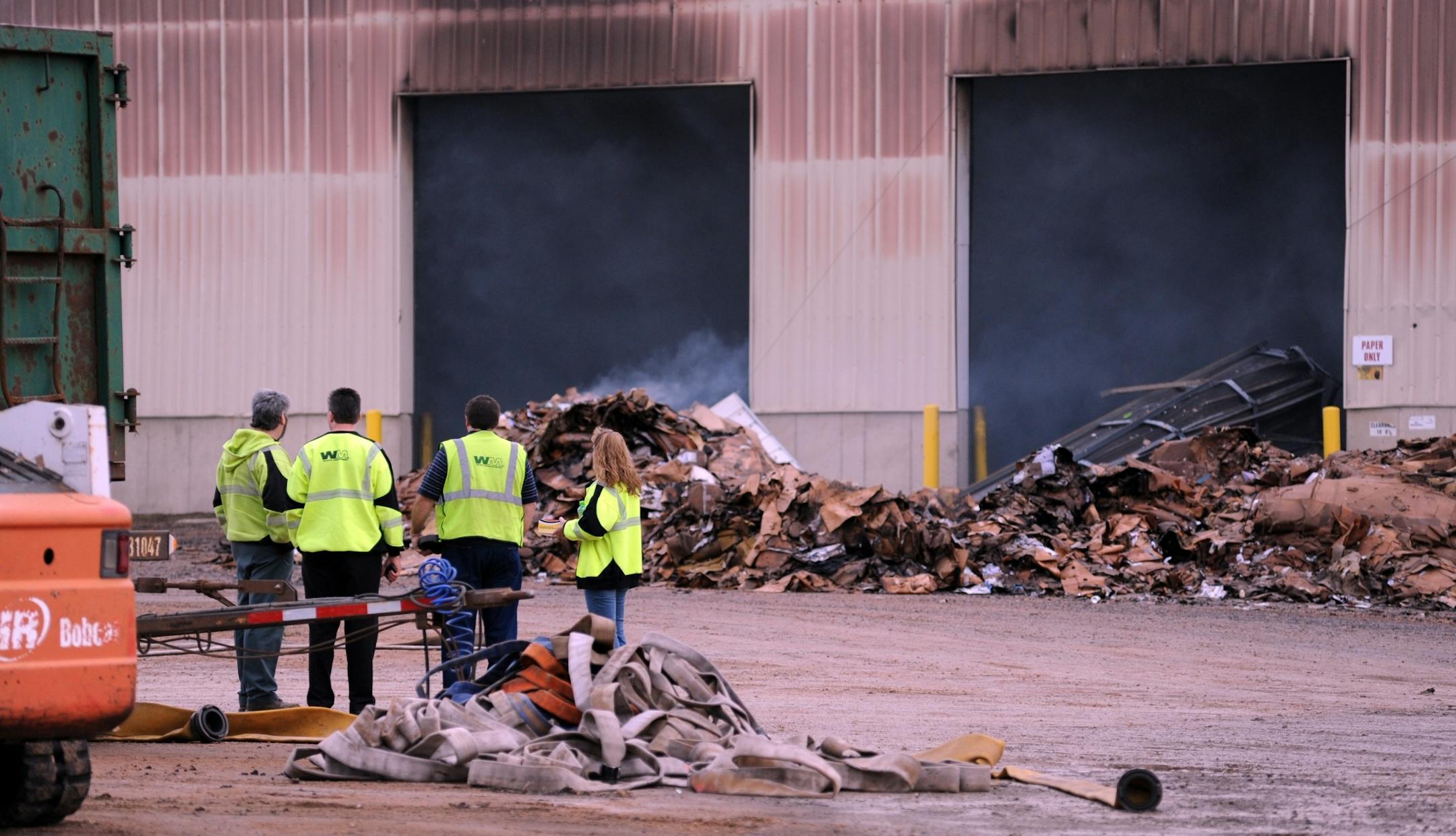A Waste Management facility in Norwood Young America burned through much of the early morning hours Tuesday, bringing a substantial number of firefighters to the scene to fight the blaze. The smoke was still pouring from the plant and crossing over Hwy 212