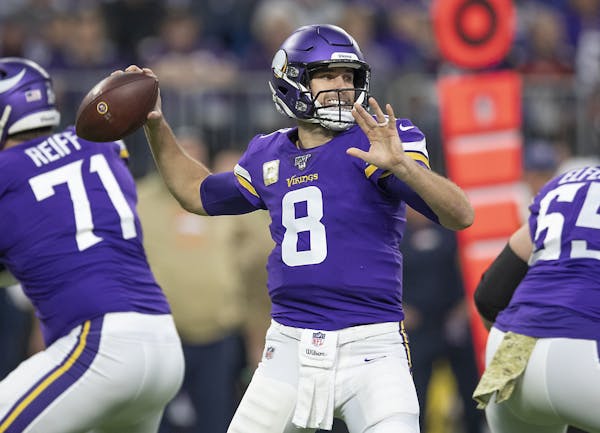 Minnesota Vikings' quarterback Kirk Cousins looked downfield for a pass in the first quarter.