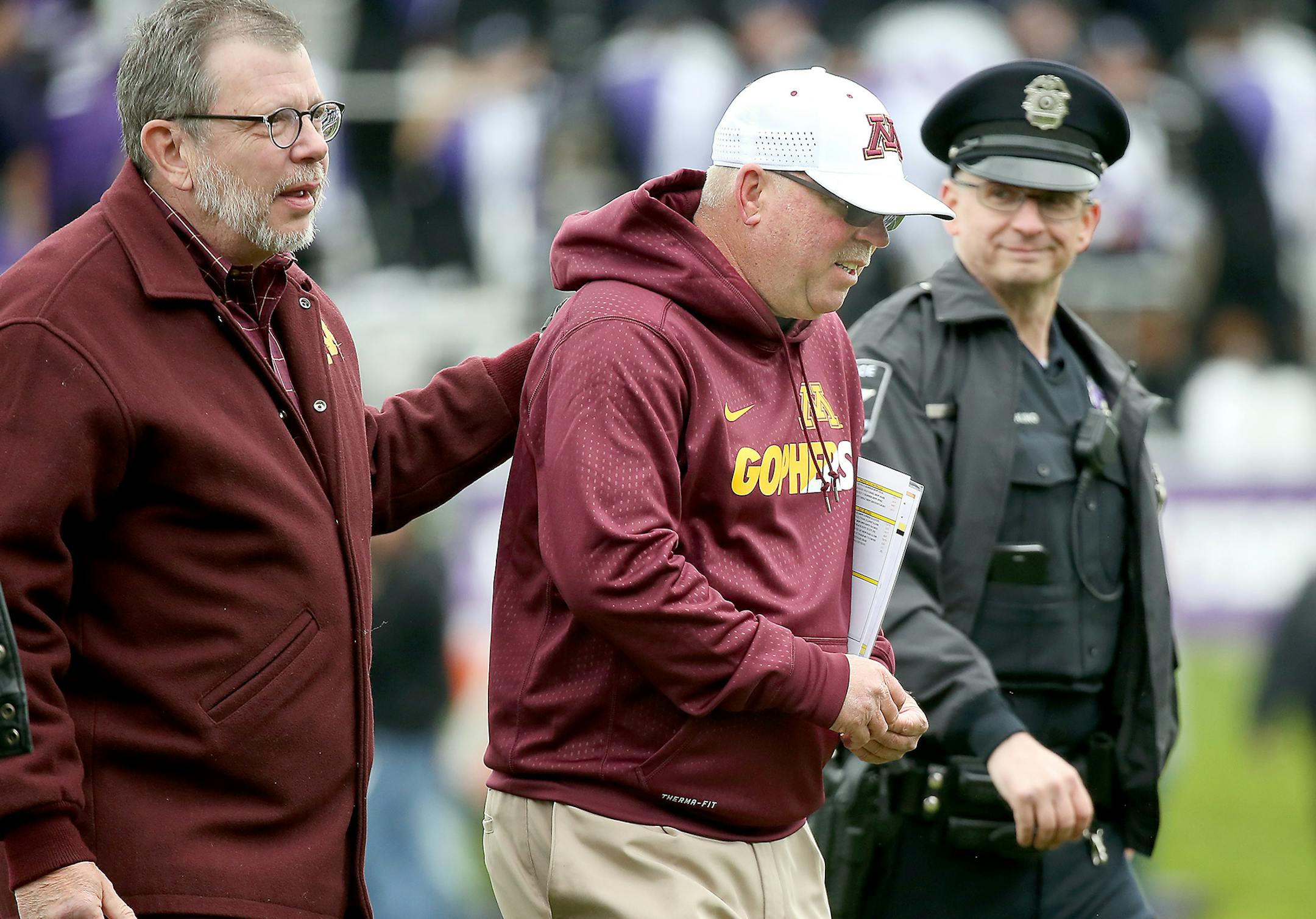 Eric Kaler (left) and Jerry Kill