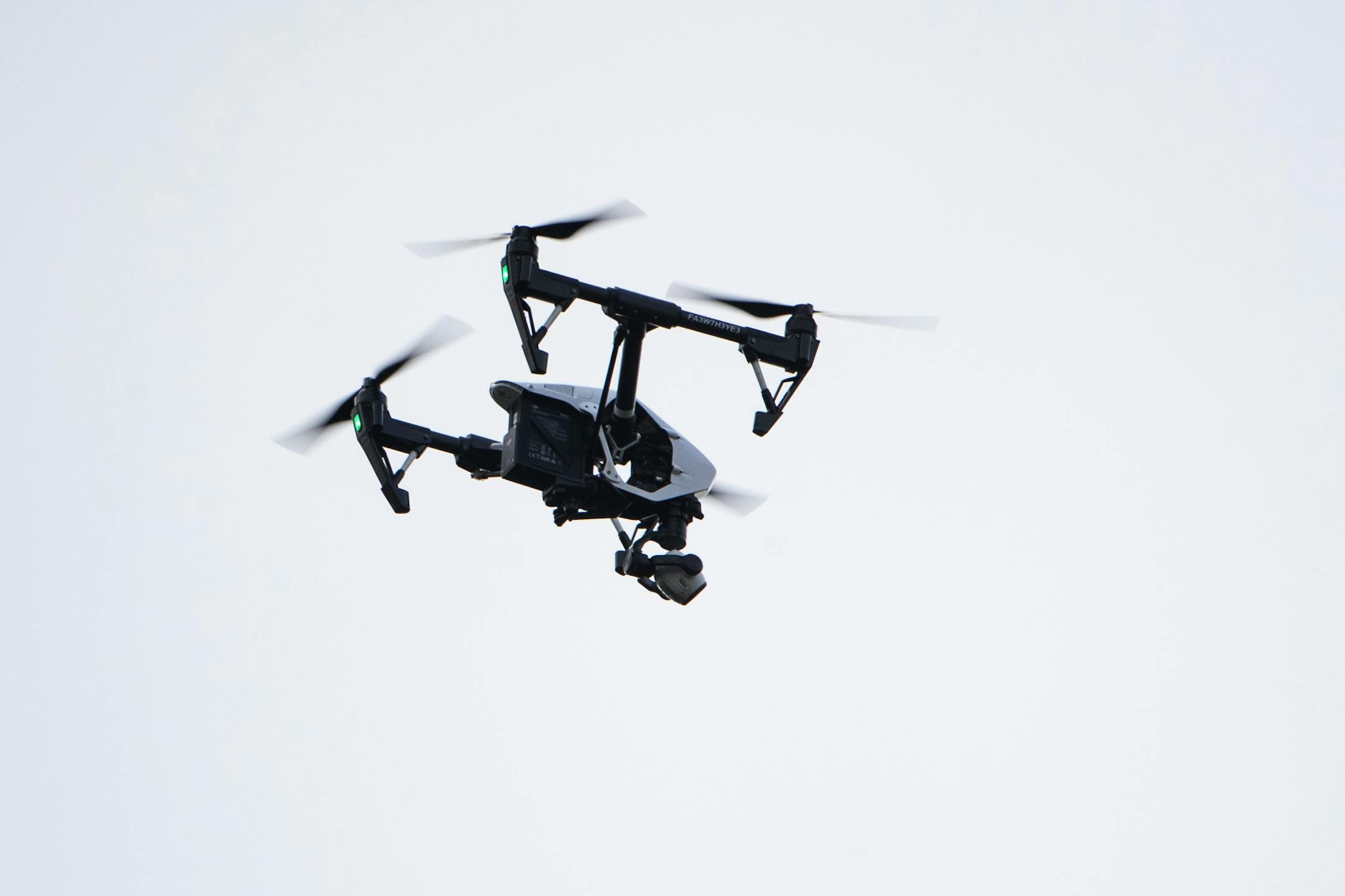 FILE - In this Thursday, Aug. 8, 2019, file photo, a drone flies in a residential neighborhood in Upper Moreland, Pa. Researchers say that the recreational drone market could come together with the wearables market to produce what may one day be a fixture in personal health and wellness: fitness drones. (AP Photo/Matt Rourke, File)