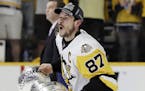 Pittsburgh Penguins center Sidney Crosby celebrates with the Stanley Cup after defeating the Nashville Predators 2-0 in Game 6 of the NHL hockey Stanl