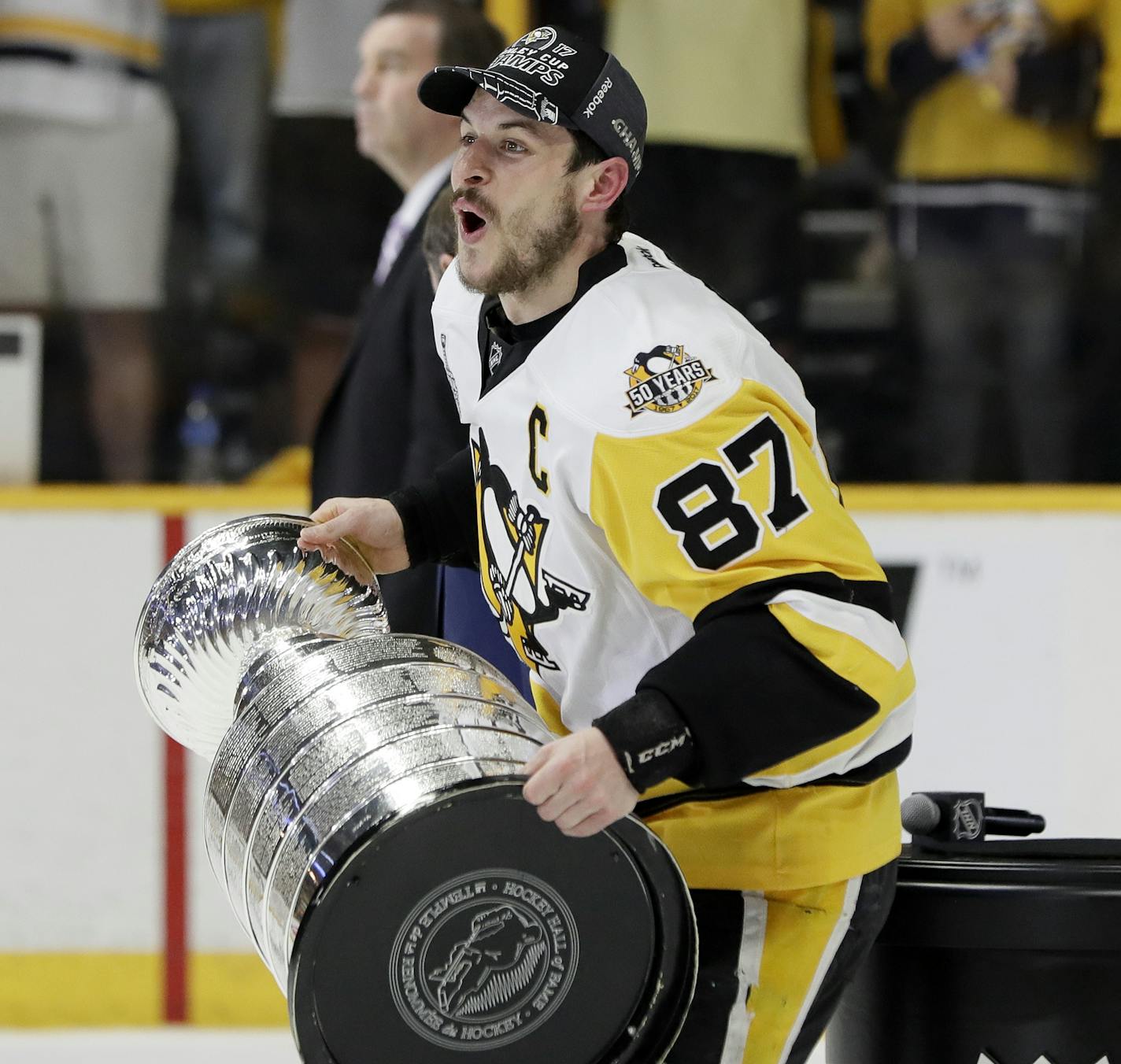 Pittsburgh Penguins center Sidney Crosby celebrates with the Stanley Cup after defeating the Nashville Predators 2-0 in Game 6 of the NHL hockey Stanley Cup Finals Sunday, June 11, 2017, in Nashville, Tenn. (AP Photo/Mark Humphrey)