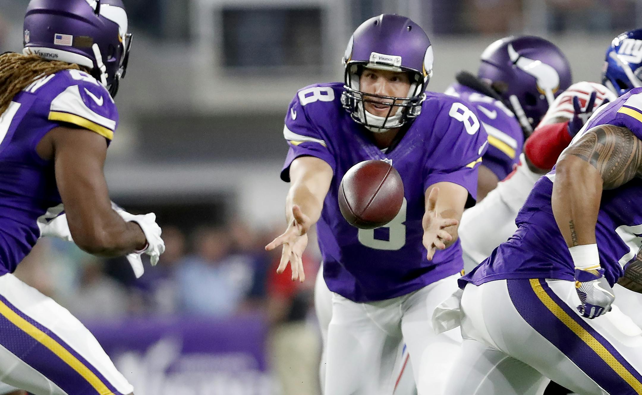 Sam Bradford (8) pitched the ball to Cordarrelle Patterson (84) in the first quarter. Bradford has not thrown an interception this season in 95 attempts.