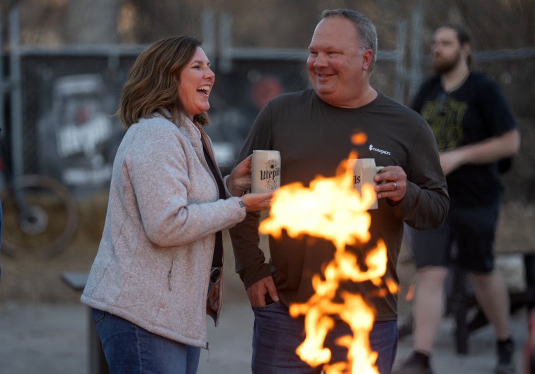Kristin Rortvedt and Kevin Fuller relaxed with a cold beer at Utepils Brewing in Minneapolis.