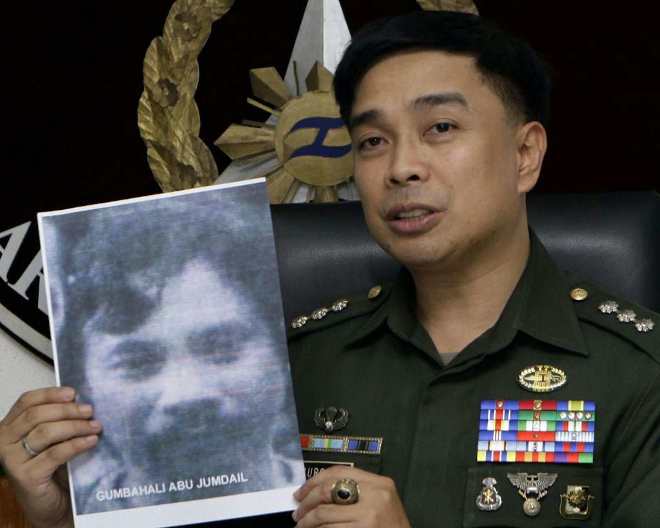 Philippines military spokesman Col. Marcelo Burgos showed a picture of Abu Sayyaf leader Umbra Jumdail on Thursday.