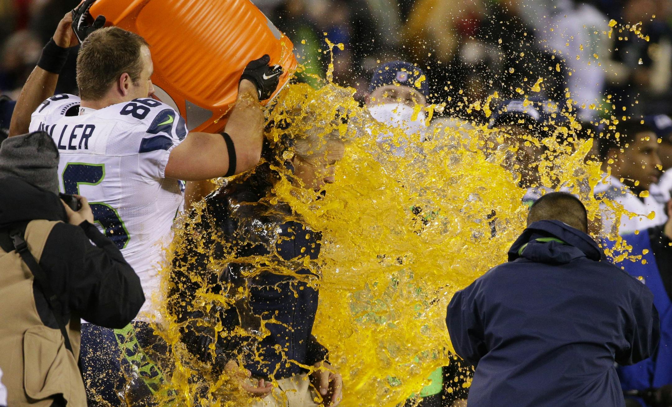 Seattle Seahawks players dump Gatorade on head coach Pete Carroll at the conclusion of a 43-8 win against the Denver Broncos in Super Bowl XLVIII.
