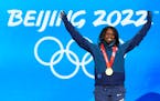 Gold Medalist Erin Jackson of the United States celebrates during the medal ceremony for the speedskating women's 500-meter race at the 2022 Winter Ol