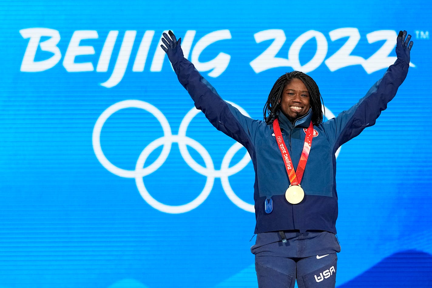 Gold Medalist Erin Jackson of the United States celebrates during the medal ceremony for the speedskating women's 500-meter race at the 2022 Winter Olympics, Monday, Feb. 14, 2022, in Beijing. (AP Photo/Sue Ogrocki)