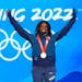 Gold Medalist Erin Jackson of the United States celebrates during the medal ceremony for the speedskating women's 500-meter race at the 2022 Winter Ol