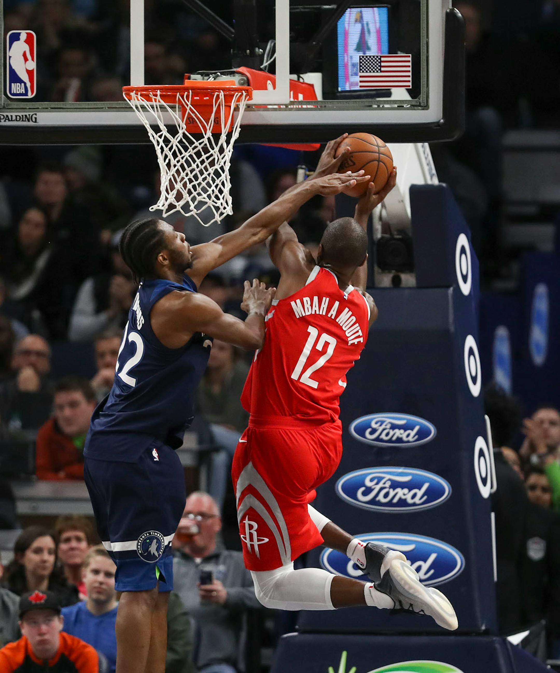 Minnesota Timberwolves forward Andrew Wiggins (22) defended Houston Rockets forward Luc Mbah a Moute (12) as he shot in the second half.