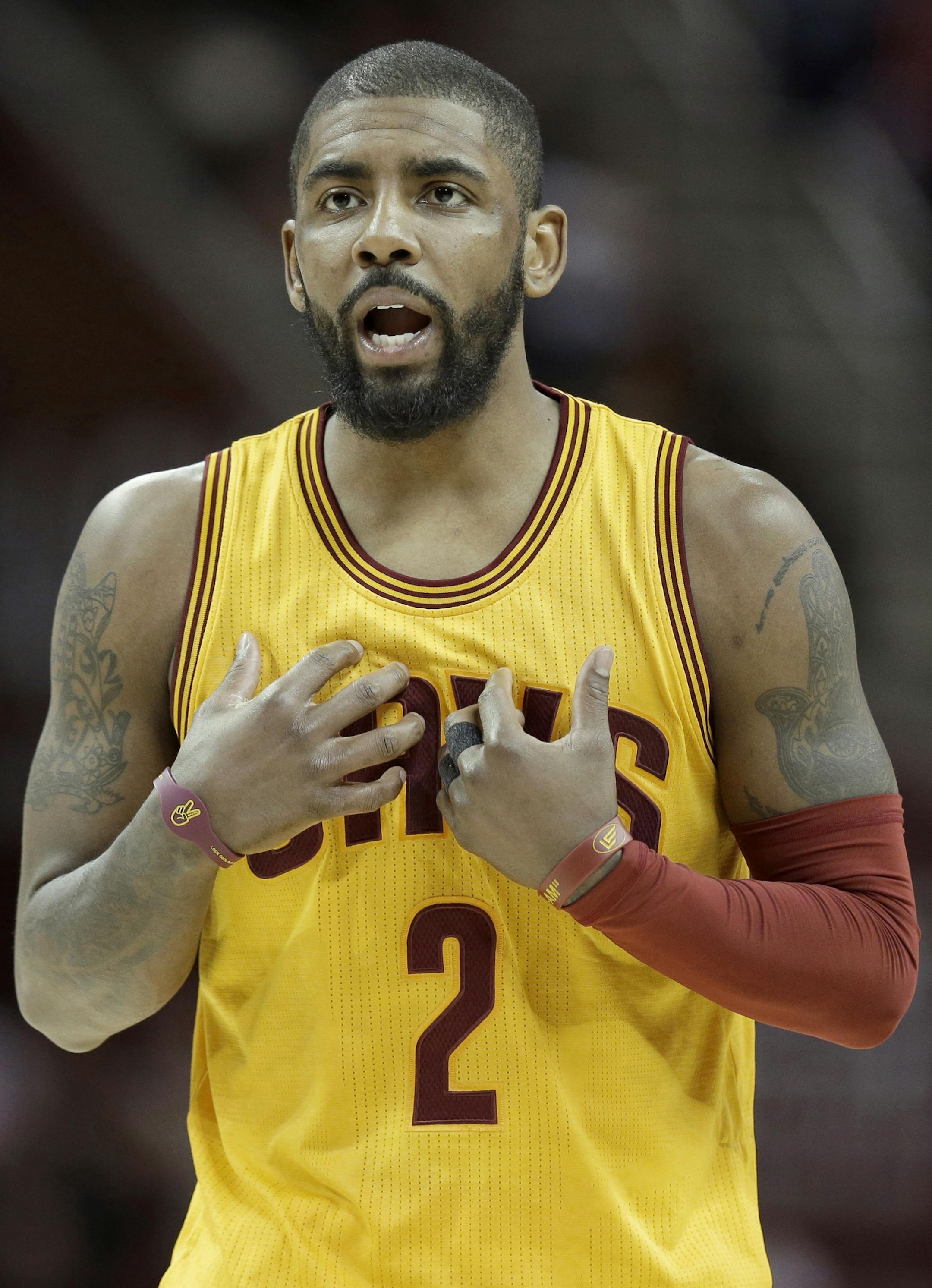 FILE - In this Feb. 27, 2017, file photo, Cleveland Cavaliers' Kyrie Irving talks with a teammate in the first half of an NBA basketball game against the Milwaukee Bucks in Cleveland. Two people familiar with the situation says All-Star guard Kyrie Irving has asked the Cavaliers to trade him. Irving made the request last week to owner Dan Gilbert, said the persons who spoke Friday, July 21, 2017, to the Associated Press on condition of anonymity because the team is not commenting on the star&#xe
