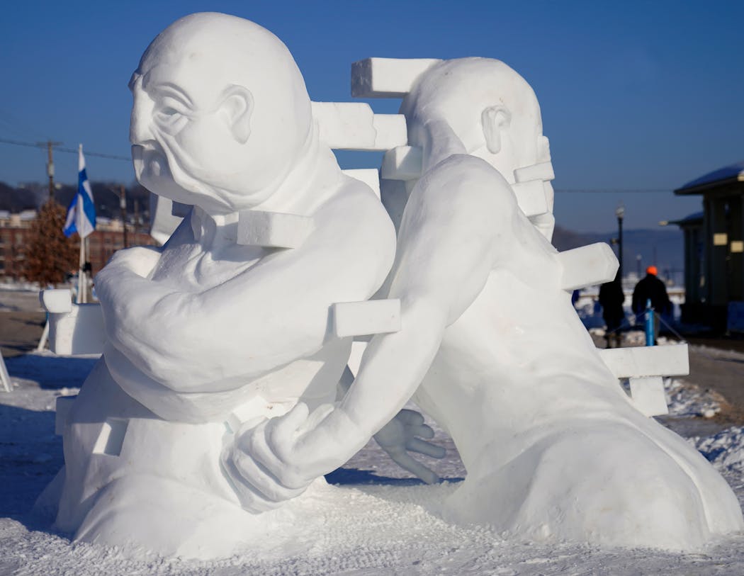 “Journey,” an entry in the World Snow Sculpting Championship in Stillwater, was sculpted by the House of Thune team. David Aichinger, one of the members, lost his business, Natural Heritage Art Center, to fire in Osceola, Wis., on Jan. 18.