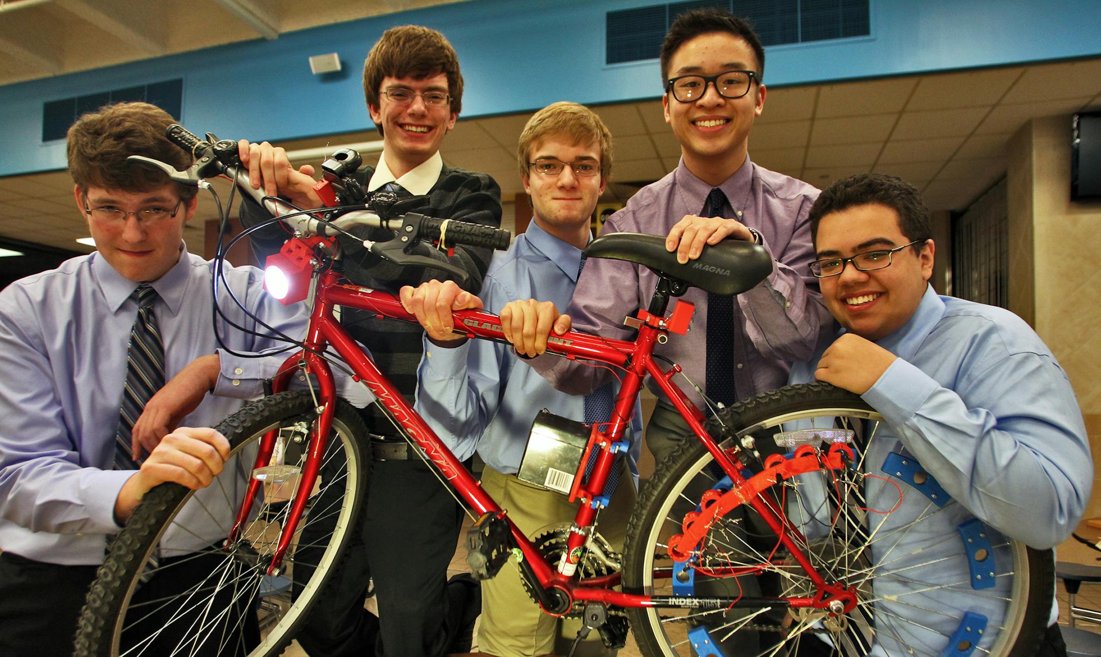 Seniors at Blaine high school enrolled in the Center for Engineering, Mathematics and Science program held a presentation night recently to display their individual projects. These students designed a bike that operates a headlamp from energy derived by placing magnets on the spokes of the rear wheel. Nick Lindberg, Ian Hamilton, Chris Zins, Jonathan Nguyen and Christian Vasquez, l-r.
(MARLIN LEVISON/STARTRIBUNE(mlevison@startribune.com (cq -program)