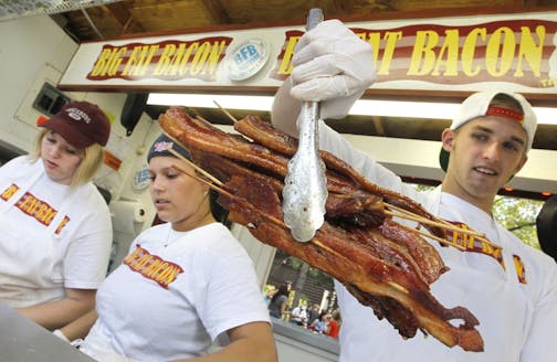 Rick Nelson gives us a lineup of fair foods and drinks that are worth standing in line to try at the 2011 Minnesota State Fair. Big Fat Bacon Stand is maned by the bacon crew, Left ot right, Sara Hadlick, Sam Huet and Derek Flaherty.