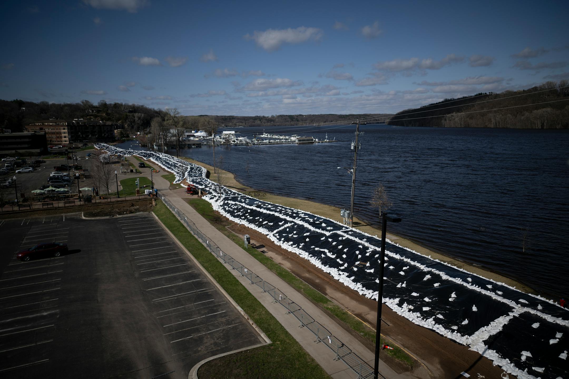 A dike is in place along the St. Croix River Monday, April 17, 2023 in Stillwater, Minn.. Many area rivers are going to crest this week, as Minnesota braces for spring flooding.