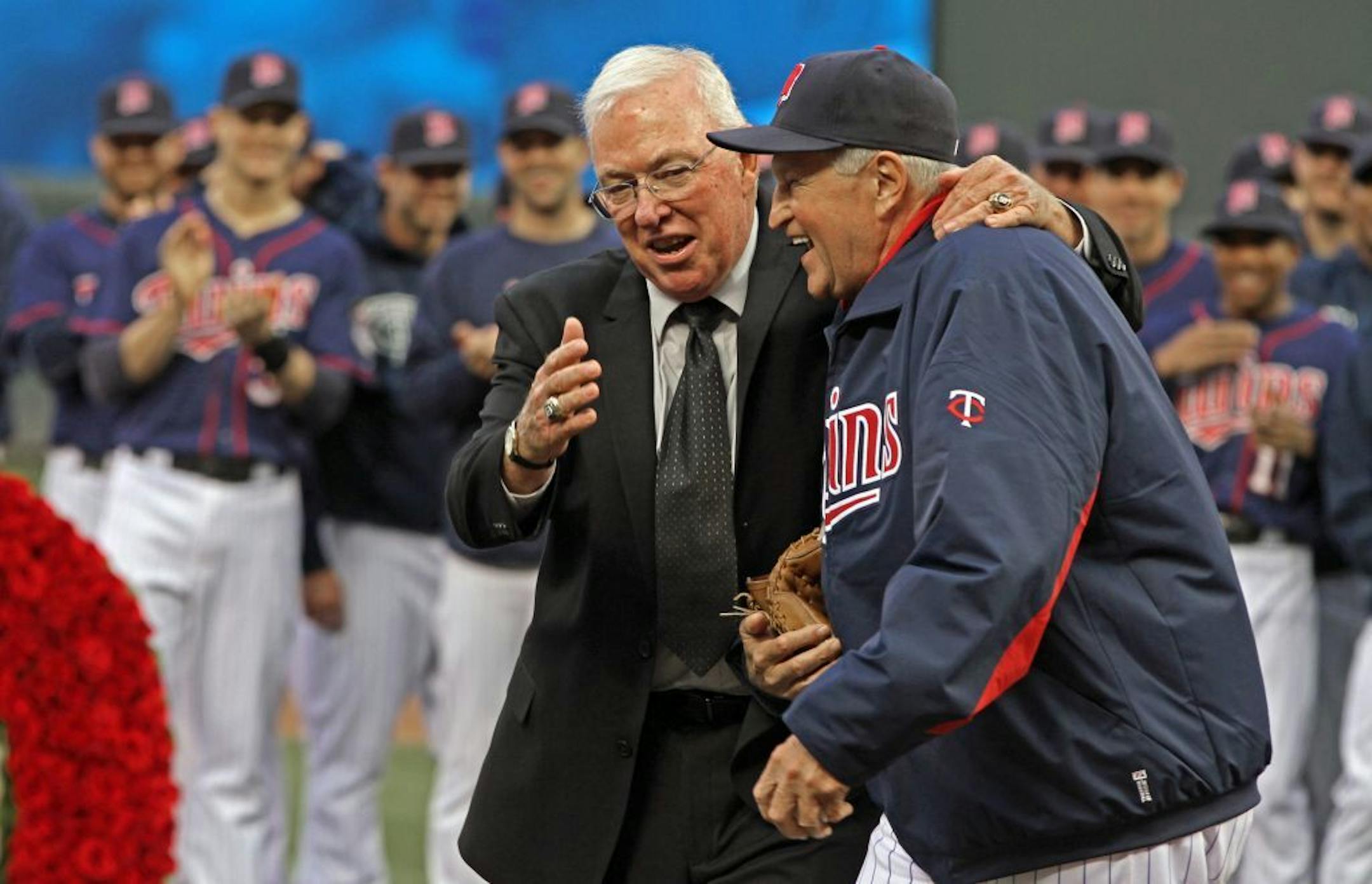 Minnesota Twins vs. Cleveland, 9/8/12, Target Field. (left to right) Former Twins Manager Tom Kelly laughed with Twins bullpen coach Rick Stelmaszek after Kelly tossed him a ceremonial pitch during the pre-game ceremony to retire the former managers number #10.