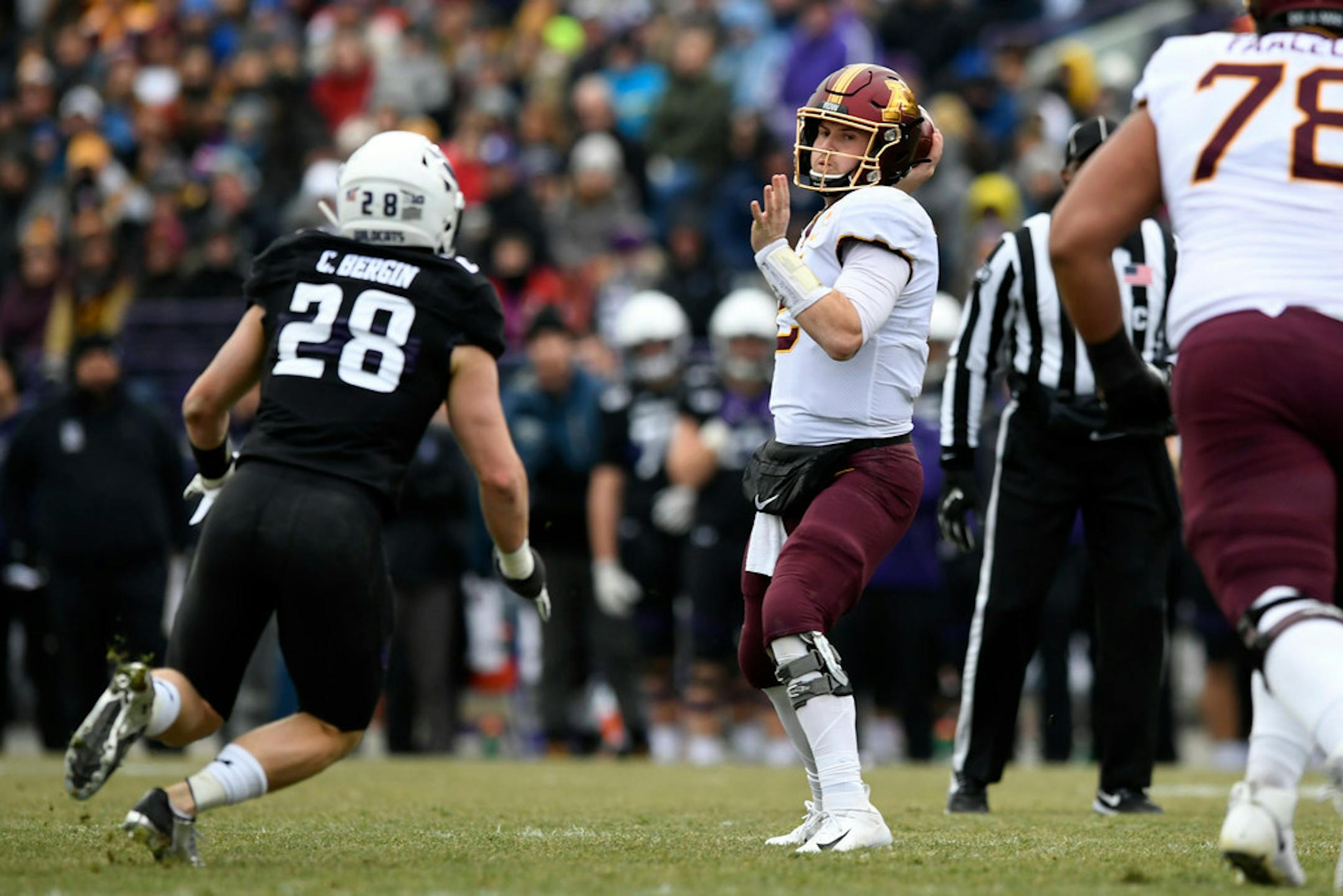 Minnesota quarterback Tanner Morgan (2) throws a pass against Northwestern linebacker Chris Bergin (27) during the first half.