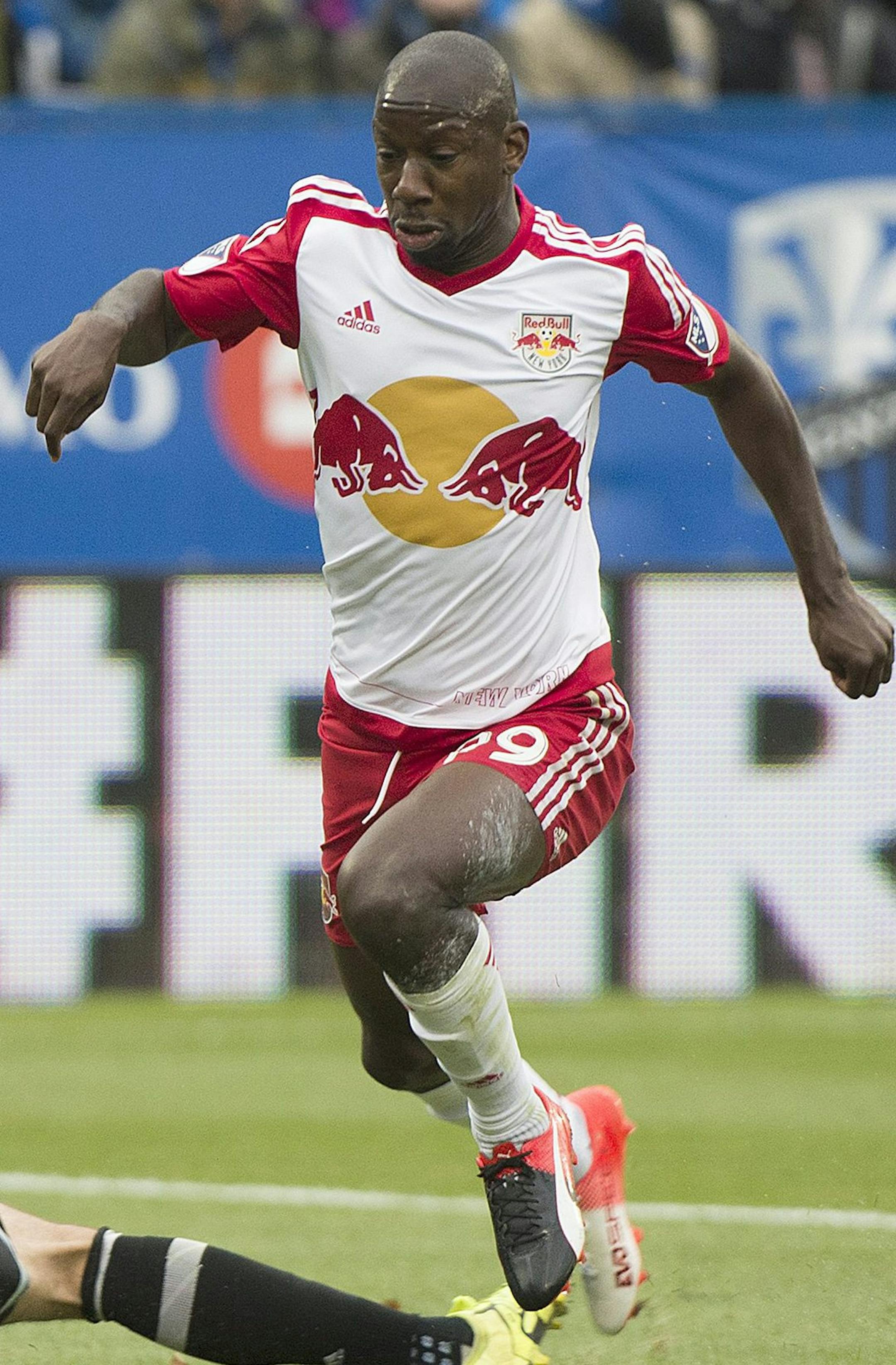 Montreal Impact's goalkeeper Evan Bush, left, challenges New York Red Bulls' Bradley Wright-Phillips during first-half action of the first leg of the Eastern Conference MLS soccer semifinal in Montreal, Sunday, Oct. 30, 2016. (Graham Hughes/The Canadian Press via AP) ORG XMIT: MIN2016110417201149