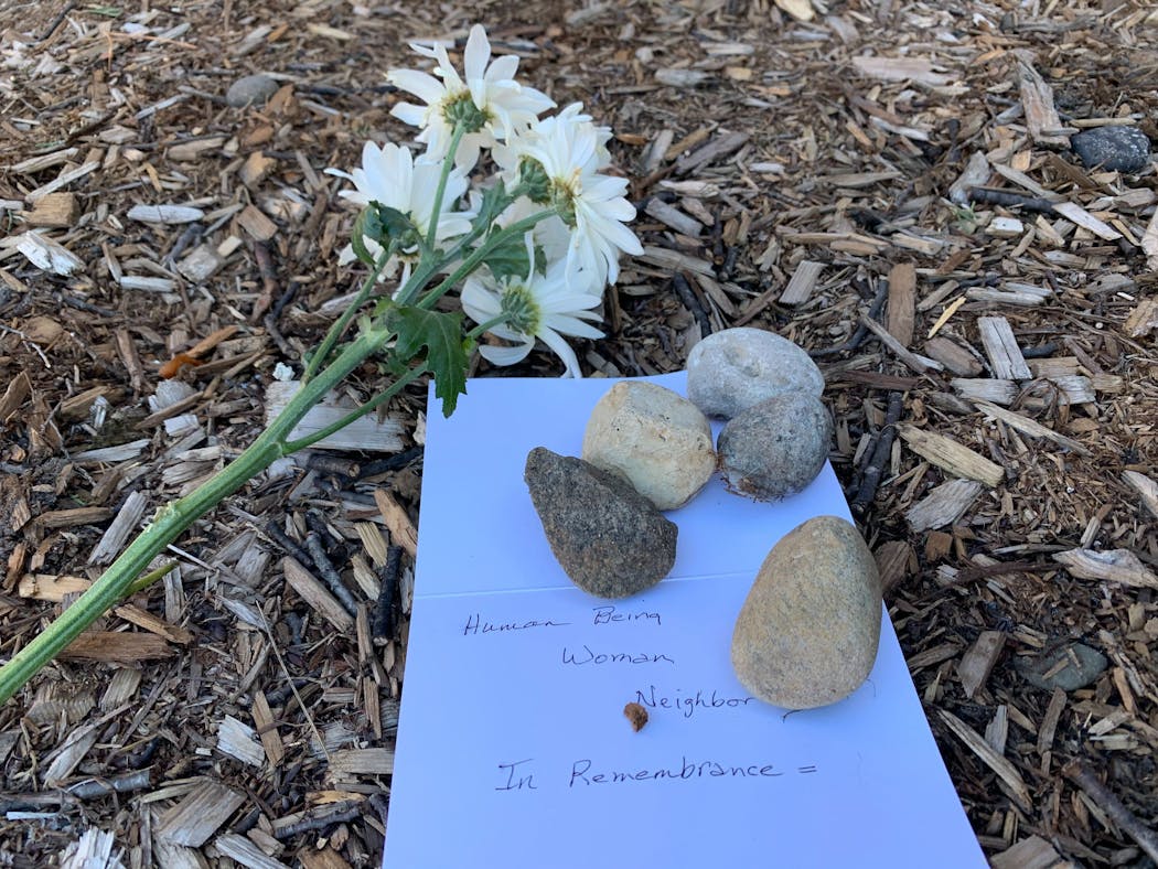 A memorial was left outside the Cove of Linden Hills apartments in honor of Kesha L. Moore, who was fatally shot Sunday.