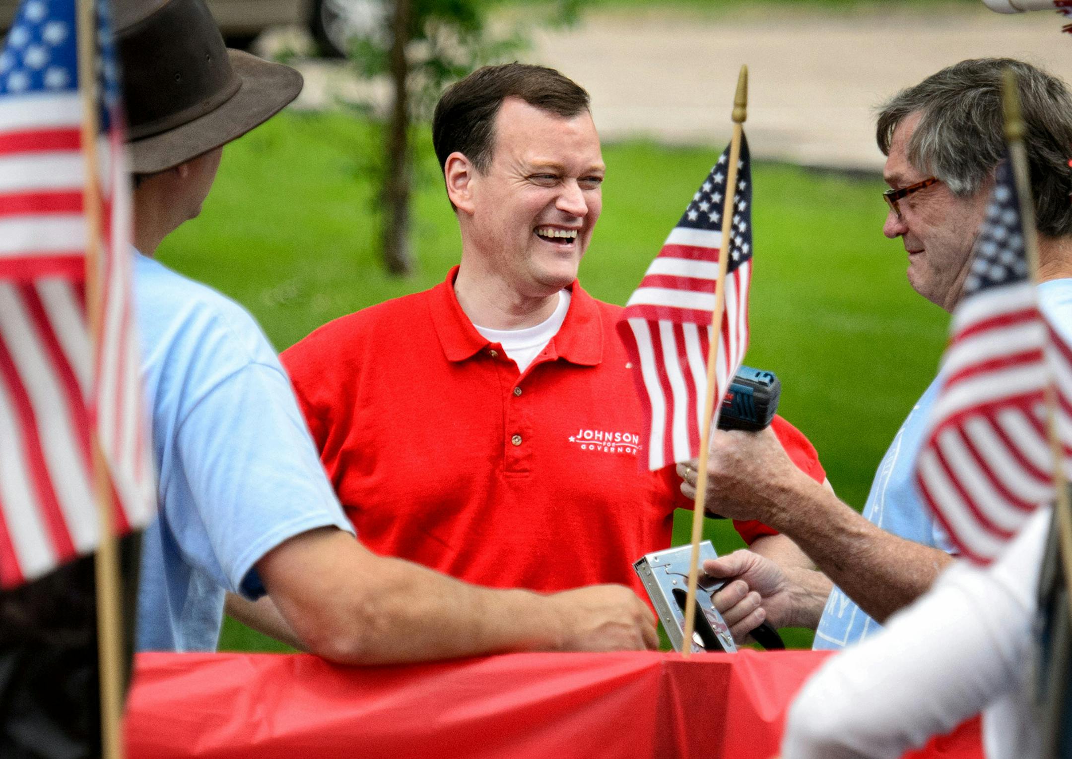 Jeff Johnson greets people before the start of the Chanhassen Fourth of July parade in 2014.