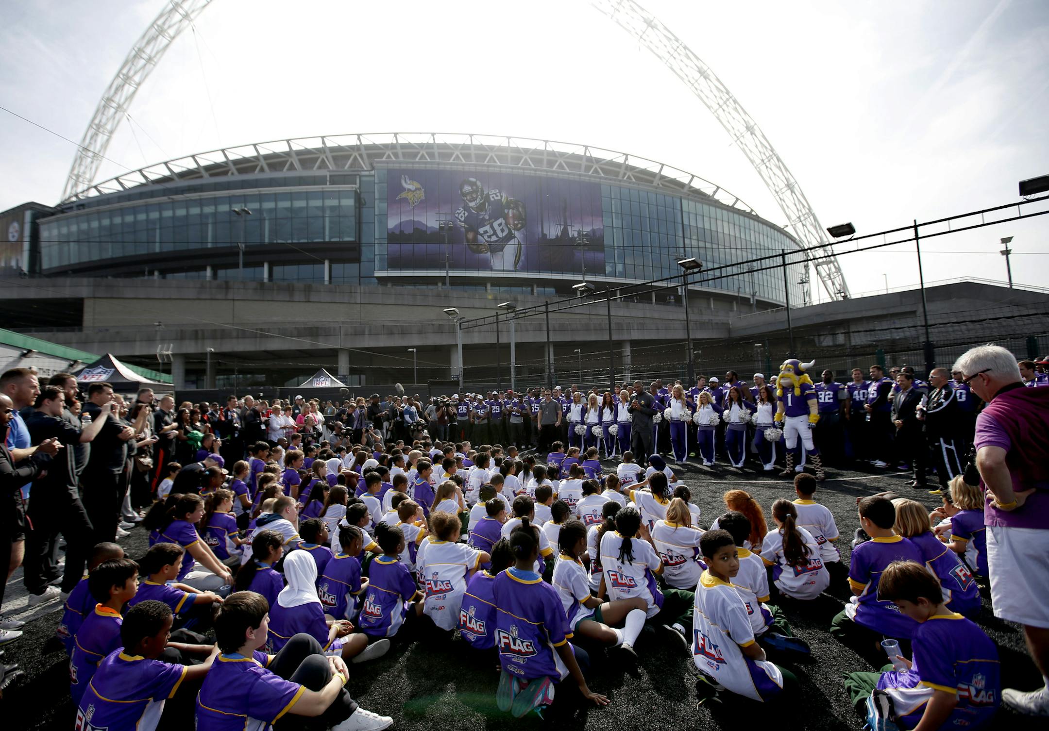 Minnesota Vikings head coach Leslie Frazier spoke with children participating in Tuesday's event outside of Wembley Stadium shortly after the team arrived in London for Sunday‚Äôs game vs. the Pittsburgh Steelers. ] CARLOS GONZALEZ cgonzalez@startribune.com September 24, 2013, London, England, UK, Wembley Stadium, ,NFL, Minnesota Vikings Community Day ‚Äì Wembley Stadium Vikings,