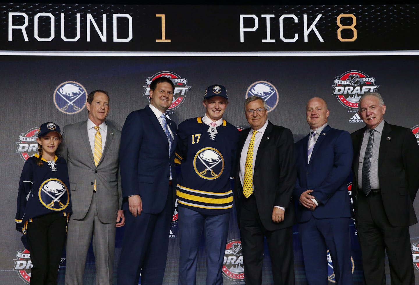 Casey Mittelstadt, center, holds a Buffalo Sabres jersey after being selected by the team in the first round of the NHL hockey draft, Friday, June 23, 2017, in Chicago. (AP Photo/Nam Y. Huh) ORG XMIT: CXA104