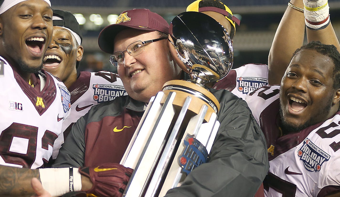 Minnesota's head coach Tracy Claeys received the Holiday Bowl trophy alongside the team after they defeated Washington State 17-12 at Qualcomm Stadium for the San Diego Holiday Bowl, Tuesday, December 27, 2016 in San Diego, CA. ] (ELIZABETH FLORES/STAR TRIBUNE) ELIZABETH FLORES &#x2022; eflores@startribune.com