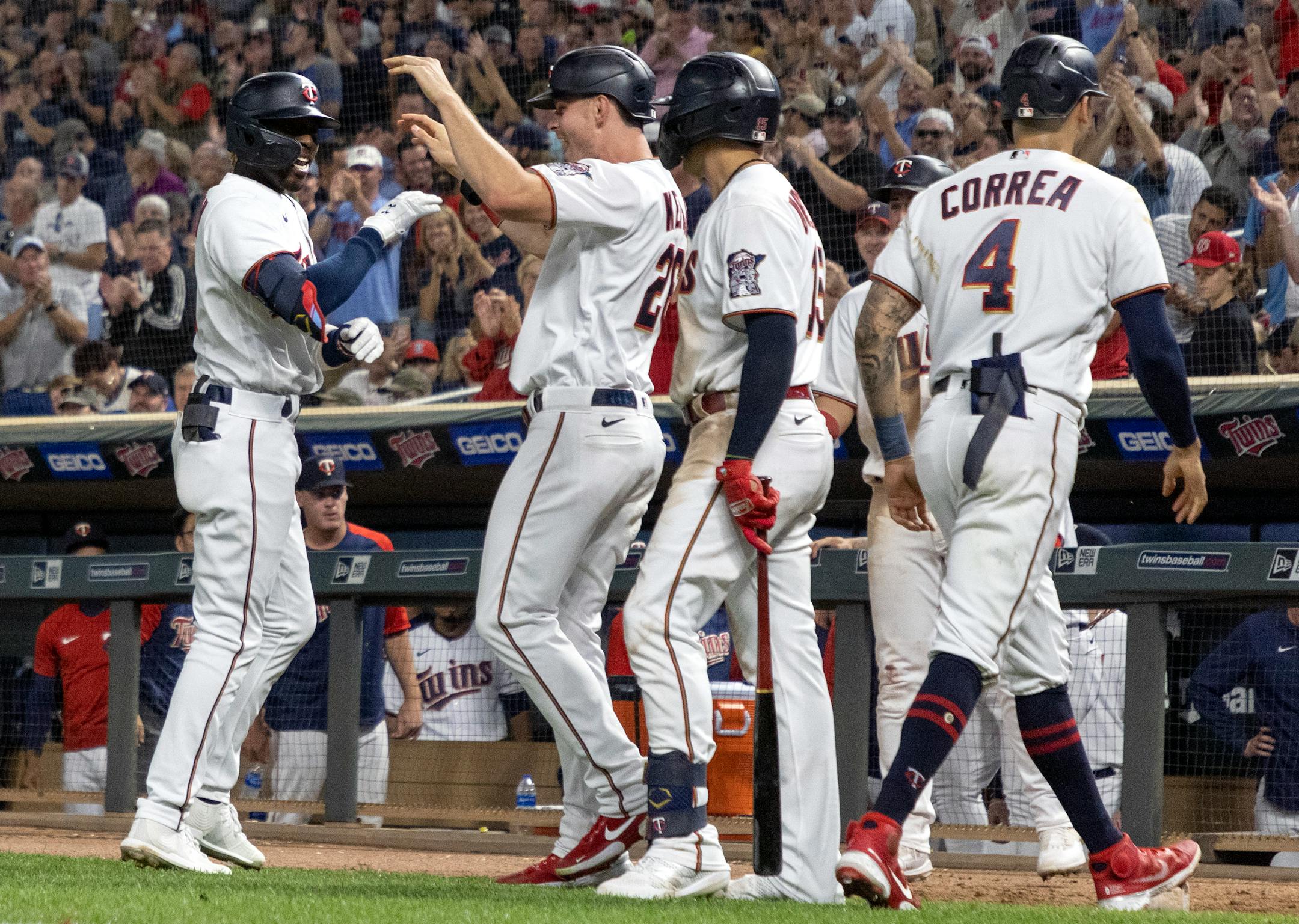 Nick Gordon of the Minnesota Twins celebrates with teammates after hitting a grand slam home run in the fifth inning.