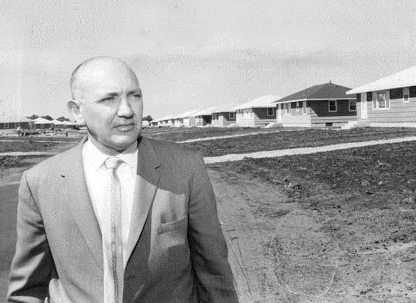 September 1994 file photo by John Croft, Minneapolis Star Tribune. Original cutline: Orron Thompson Stands Before Row of Nearly-Completed Ramblers in Coon Rapids Projec t. Sometime this afternoon a young couple will sit at a table in a tidy three-bedroom rambler and will sign an order to purchase another house just like it. By doing so they will become the 1,075th family (give or take a half dozen) to buy a new house in 1958 from Orrin Thompson, believed to be the first Upper Midwest builder to