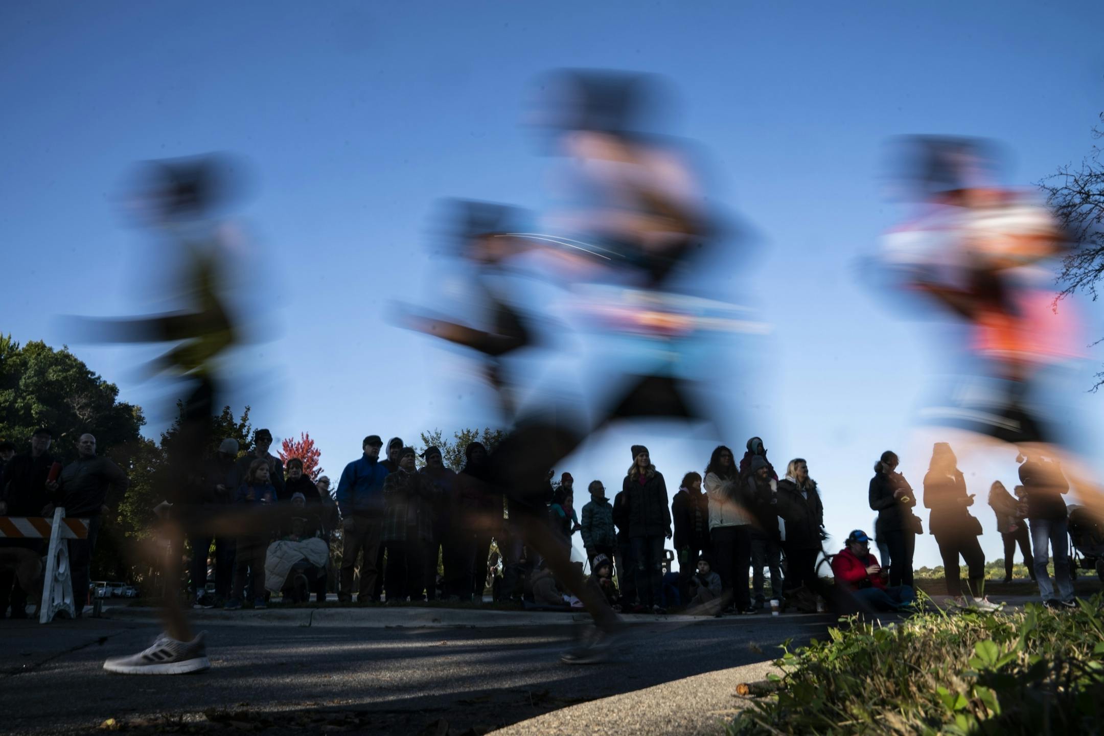 Runners ran past spectators as they approached mile eight.