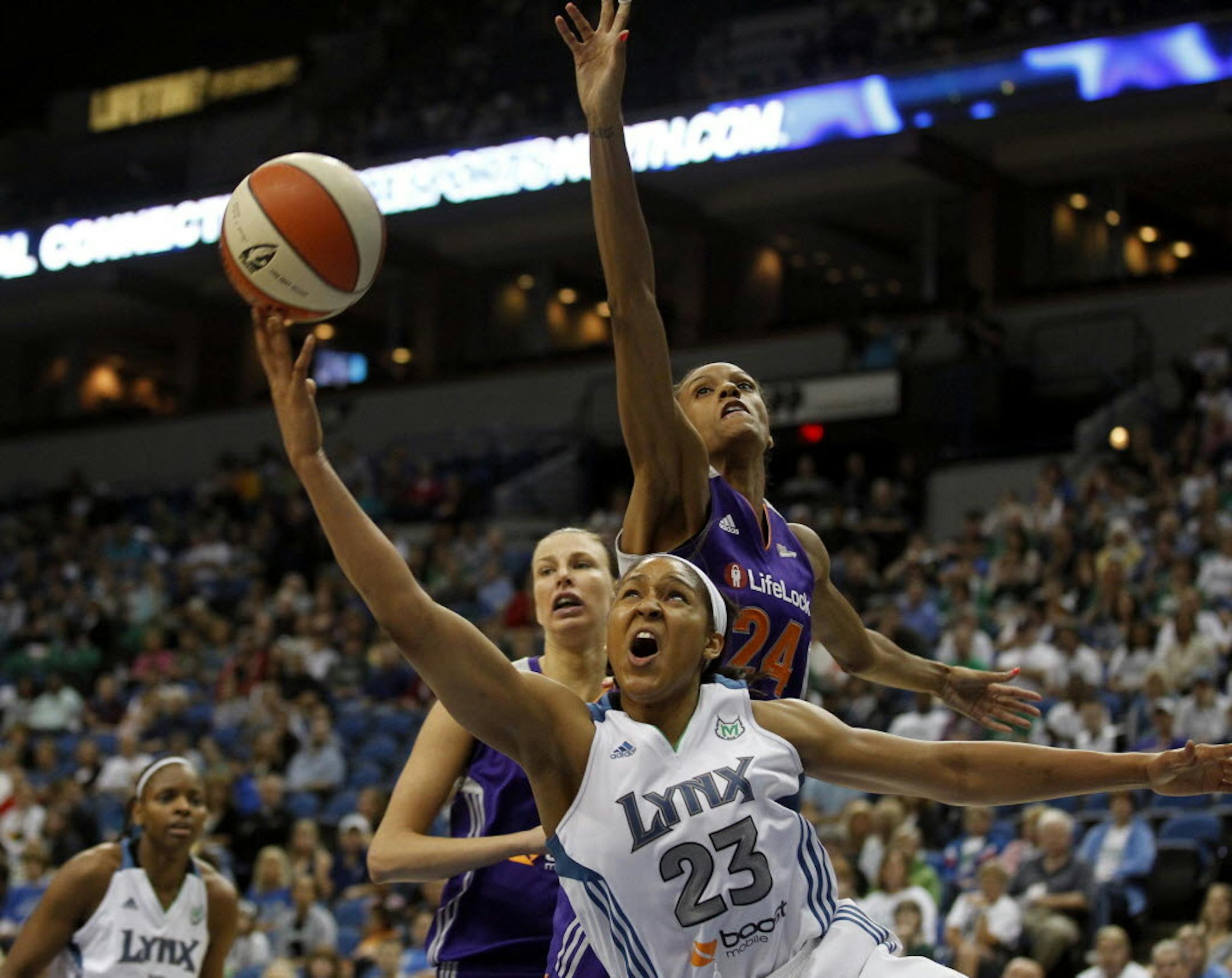 Minnesota Lynx Maya Moore score over Phoenix DeWanna Bonner during Sunday's WNBA game between the Minnesota Lynx and Phoenix Mercury at Target Center May 20, 2012 in Minneapolis, MN (Jerry Holt/ STAR TRIBUNE/jgholt@startribune.com)