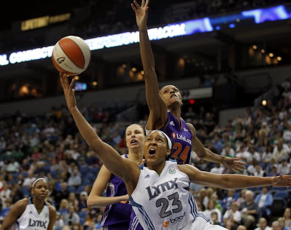 Minnesota Lynx Maya Moore score over Phoenix DeWanna Bonner during Sunday's WNBA game between the Minnesota Lynx and Phoenix Mercury at Target Center 