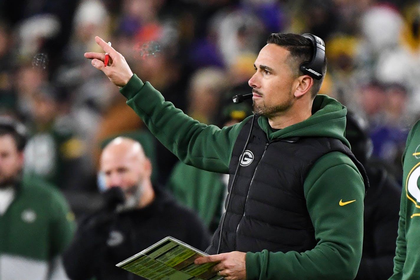 Green Bay Packers head coach Matt LaFleur gestures from the sideline during the second half an NFL football game against the Baltimore Ravens, Sunday, Dec. 19, 2021, in Baltimore. (AP Photo/Terrance Williams)