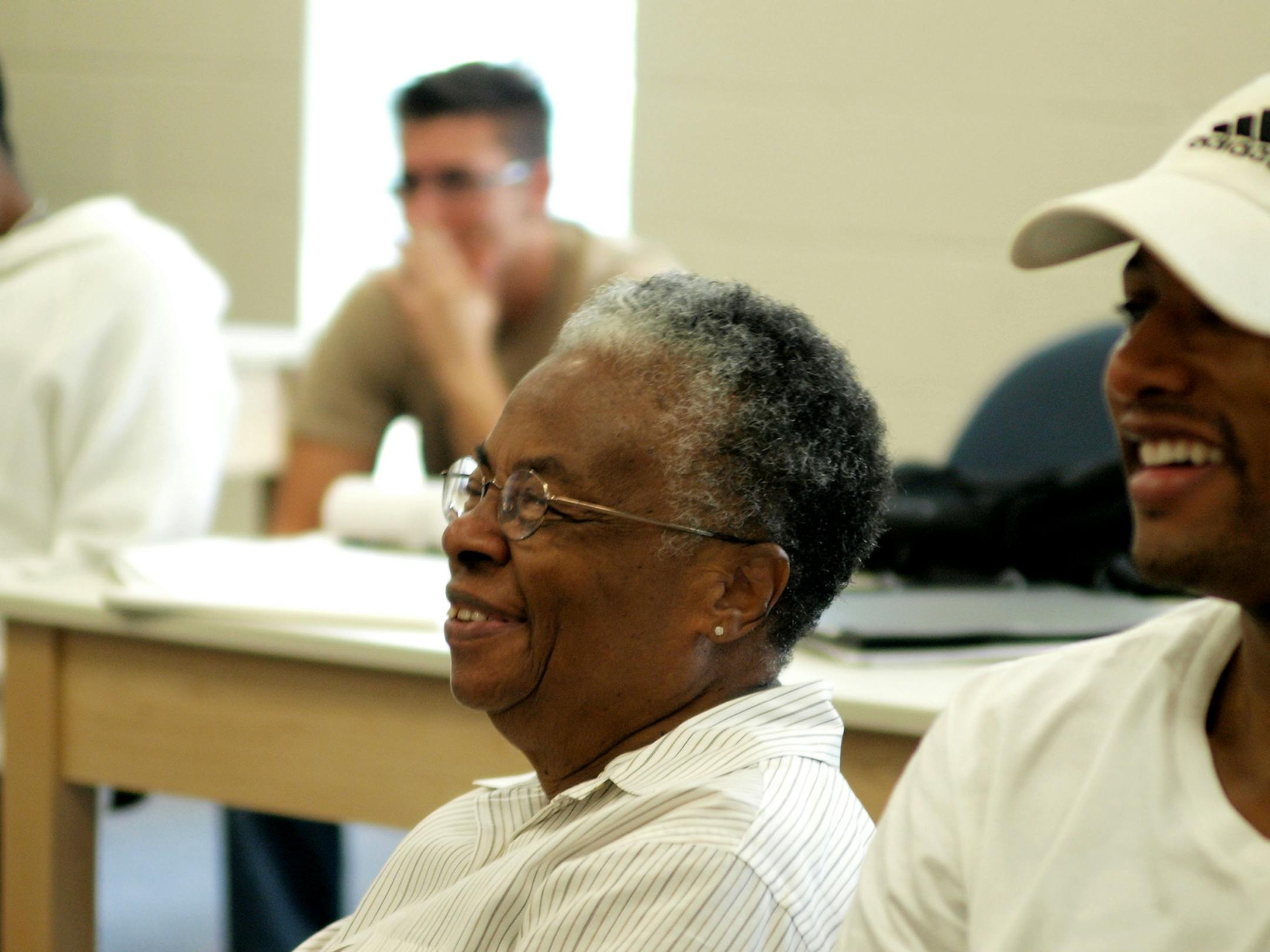 Bertha Dupre, then 87, shares a laugh with a classmate at UNC Charlotte in 2008. Dupre died in December but will get a military veteran's funeral at Salisbury National Cemetery in March. (Lisette Poole/Charlotte Observer/TNS) ORG XMIT: 1275307 ORG XMIT: MIN1903010335104428