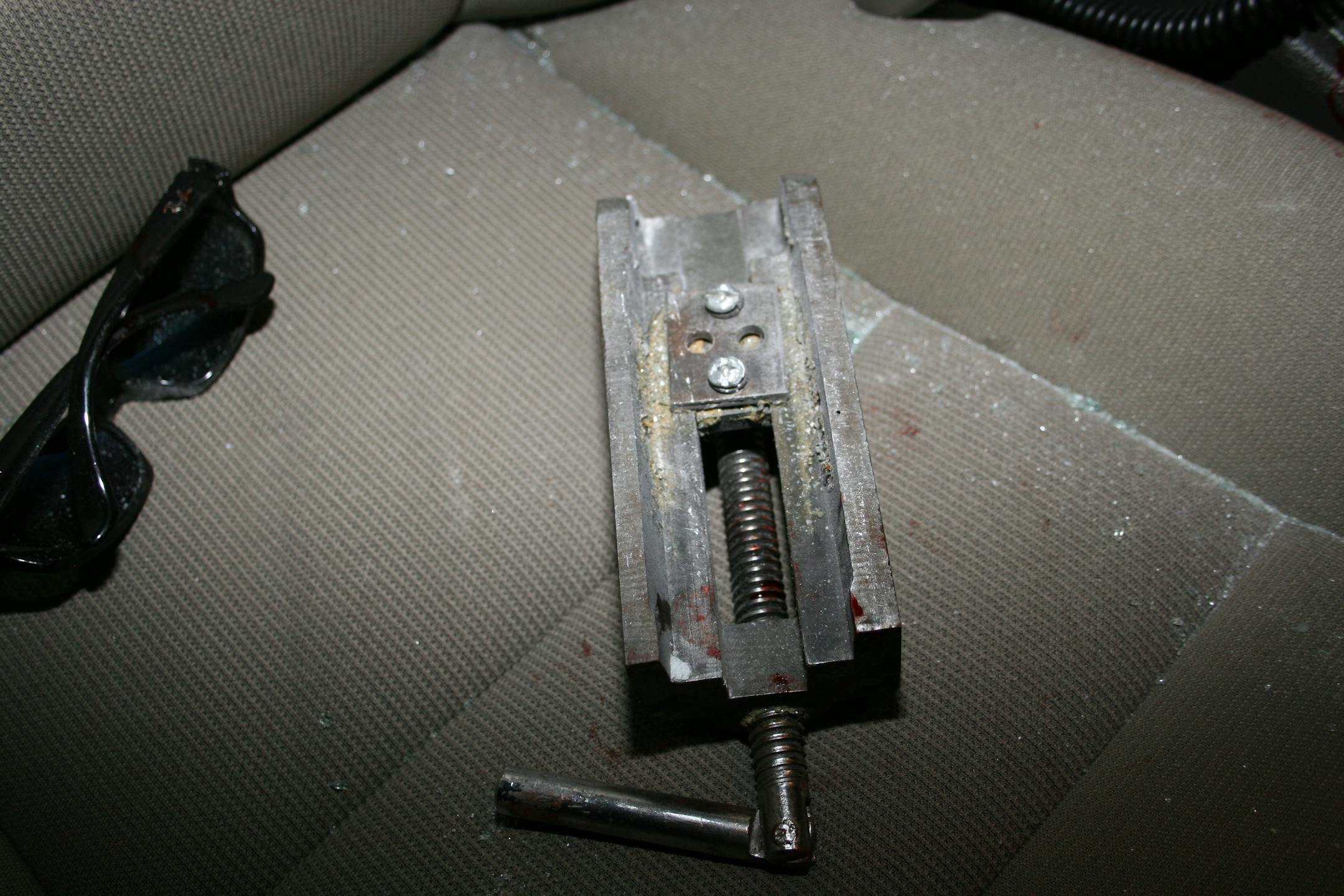 A bloodied vise was recovered after it was thrown Monday at a motorist in Bloomington, inflicting serious facial injuries.