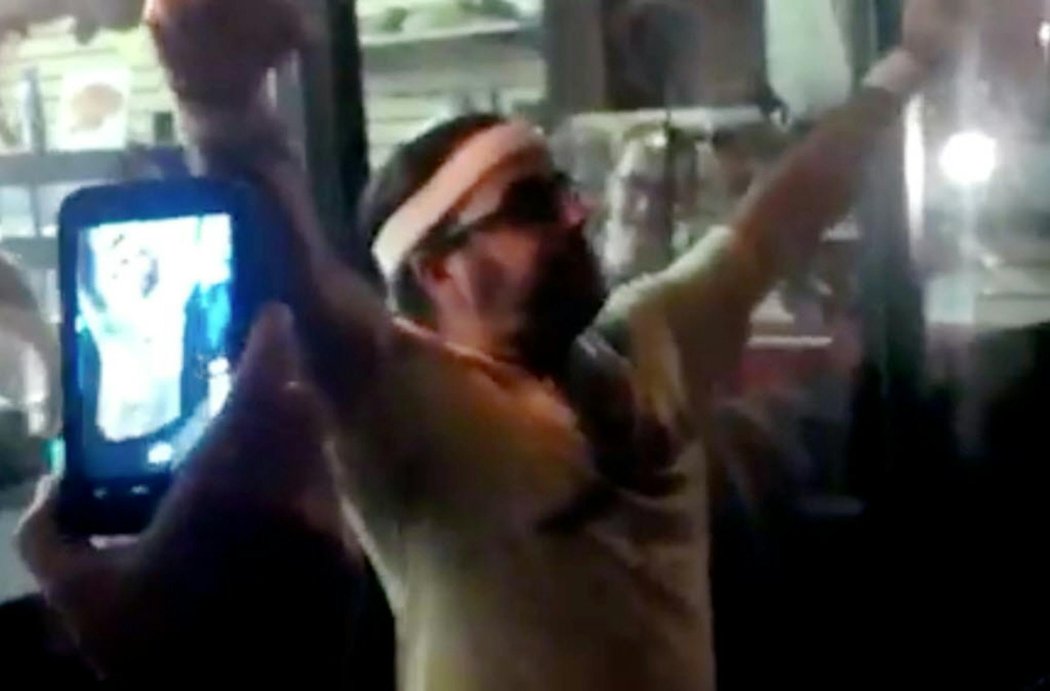 In this frame grab made from video on Oct. 5, 2012, Edward Archbold celebrates winning a roach-eating contest at Ben Siegel Reptile Store in Deerfield Beach, Fla.