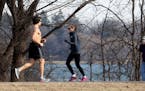 A bare-chested runner enjoyed the last of the spring-like weather while running around Lake Nokomis Wednesday, Feb. 2017, in Minneapolis, MN. Up to a 