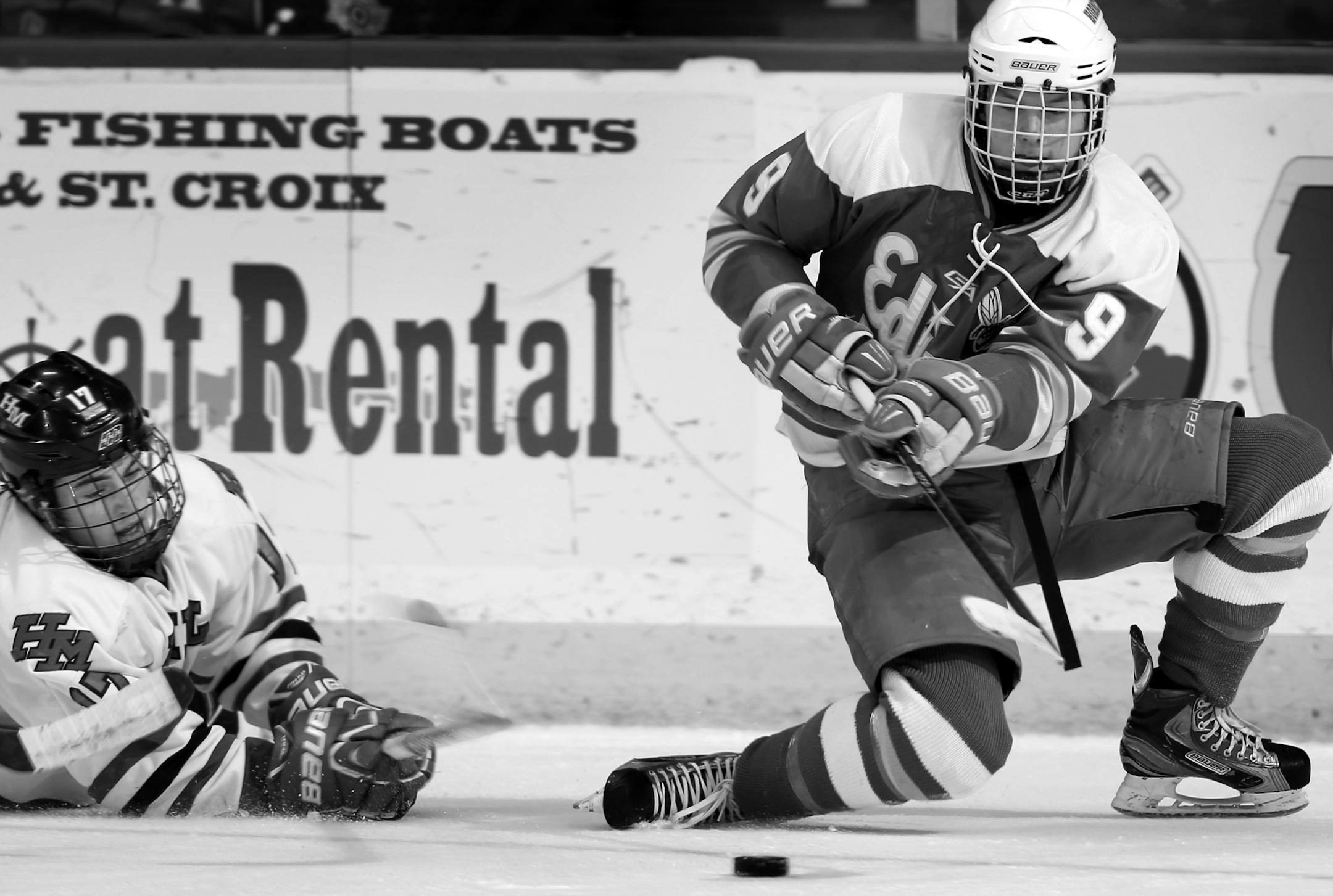 Willie Brown (17) and Cullen Munson (9) fought for the puck in the second period. Edina beat Hill-Murray by a final score of 4-2.] CARLOS GONZALEZ cgonzalez@startribune.com - March 9, 2013, St. Paul, Minn., Xcel Energy Center, Minnesota High School Boys State Hockey, 2A Finals, Hill Murray vs. Edina