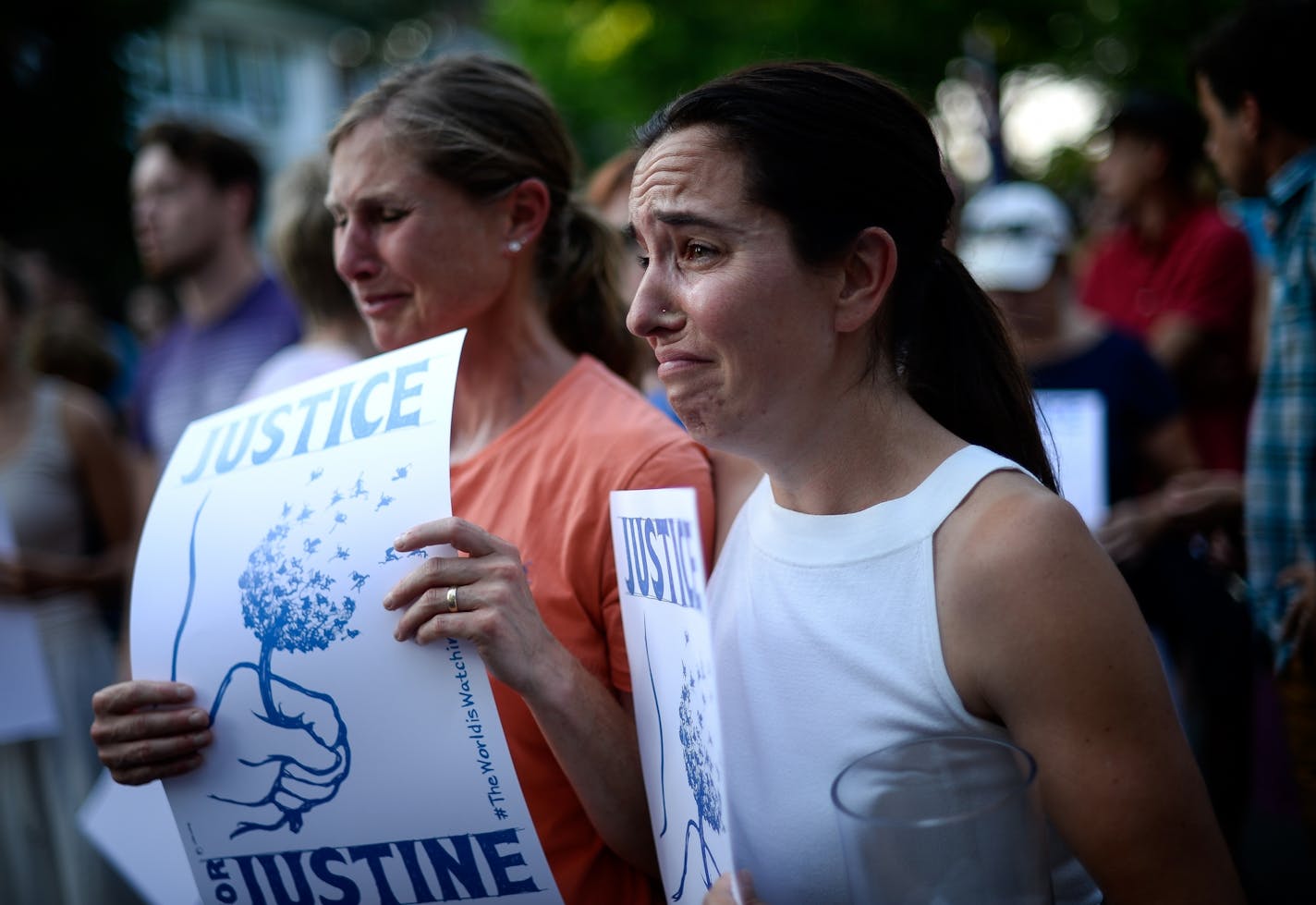 Betsy Custis, right, was overcome with emotion as she joined hundreds of people rallying and marching Thursday night in south Minneapolis to honor Justine Damond, who was shot and killed by police Saturday.