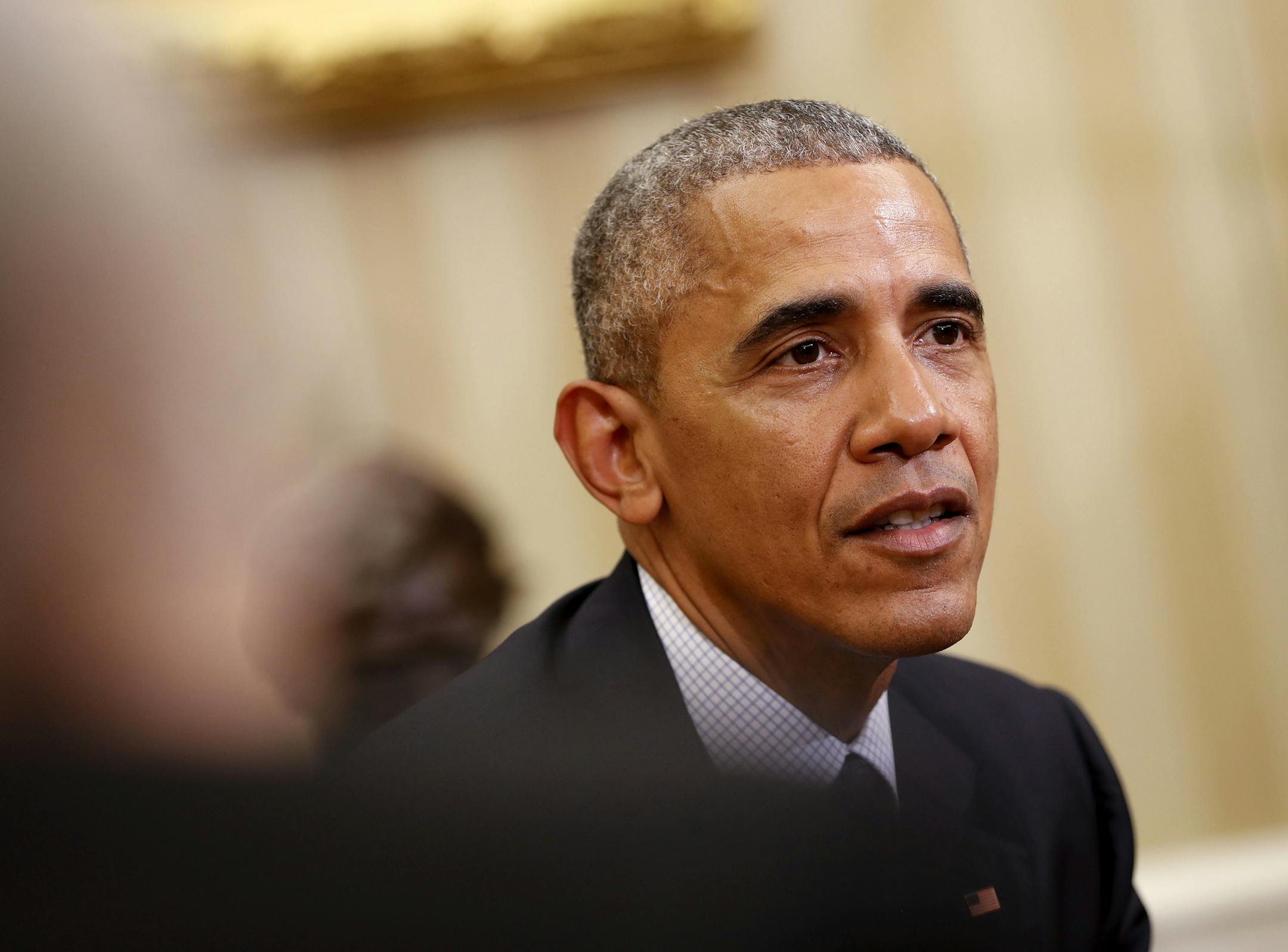 President Barack Obama listens during his meeting with the 2016 American Nobel Prize winners in the Oval Office of the White House in Washington, Wednesday, Nov. 30, 2016. (AP Photo/Pablo Martinez Monsivais)
