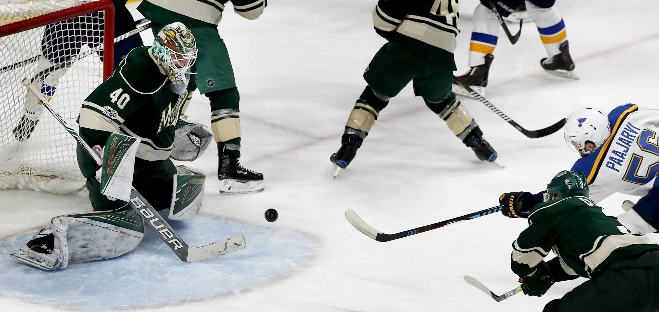 Magnus Paajarvi (56) shot the puck past Minnesota Wild goalie Devan Dubnyk (40) for the game-winning goal in overtime.