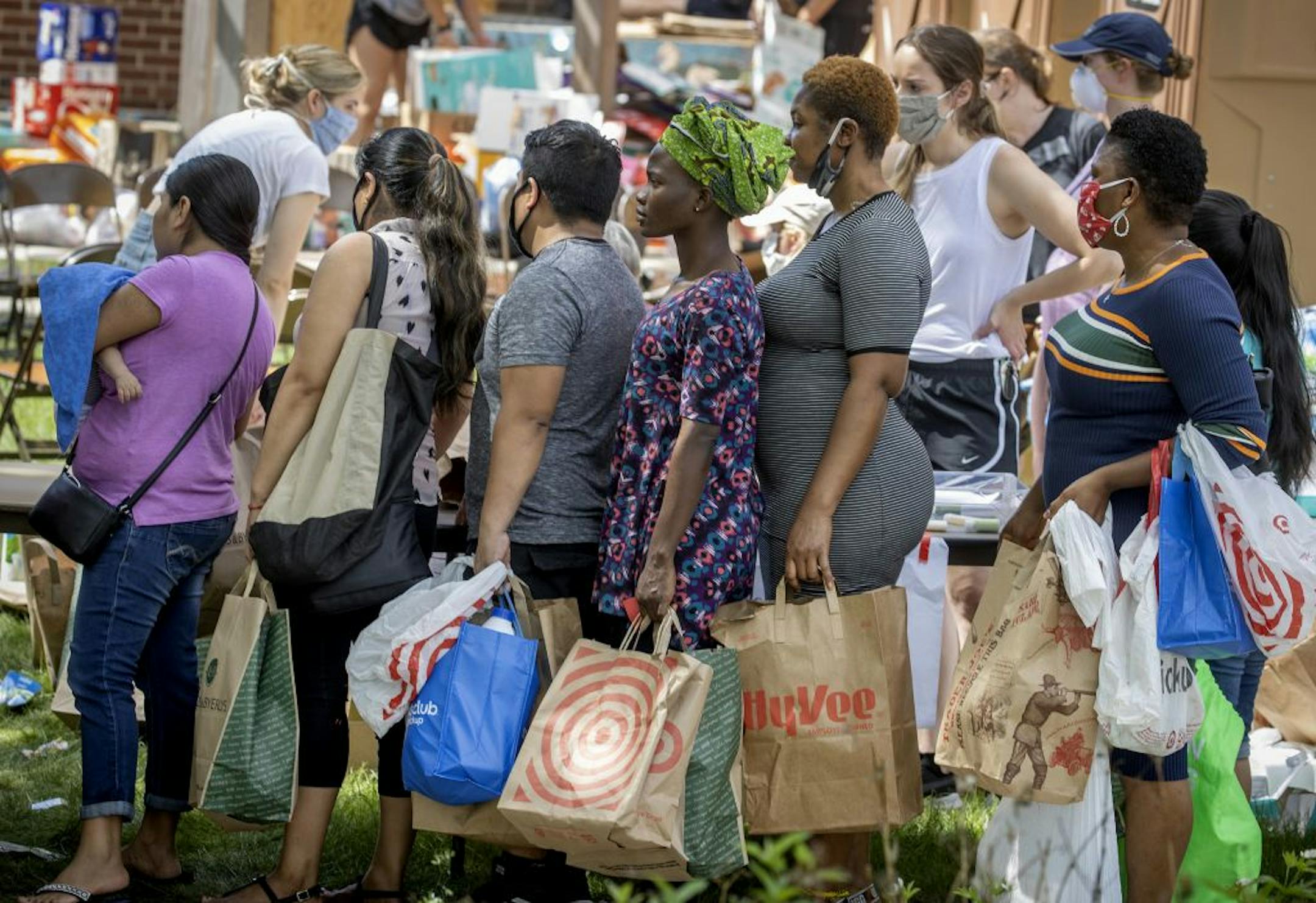 Hundreds of families in need stood in line for donations at Holy Trinity Lutheran Church, Tuesday, June 2, 2020 in Minneapolis, MN. Holy Trinity Lutheran Church took in donations after many of the local grocery stores were burned during the aftermath of the death of George Floyd in police custody.