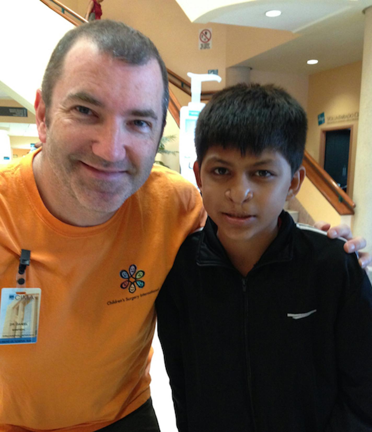 Photo courtesy of Melanie McCall: Heading home, Dr. Dan Sampson says goodbye to one of his bone graft patients.