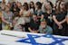 Mourners attend the funeral of Michel Nisenbaum, who was killed during Hamas' Oct. 7 attack and whose body was taken into Gaza, in Ashkelon, Israel, o