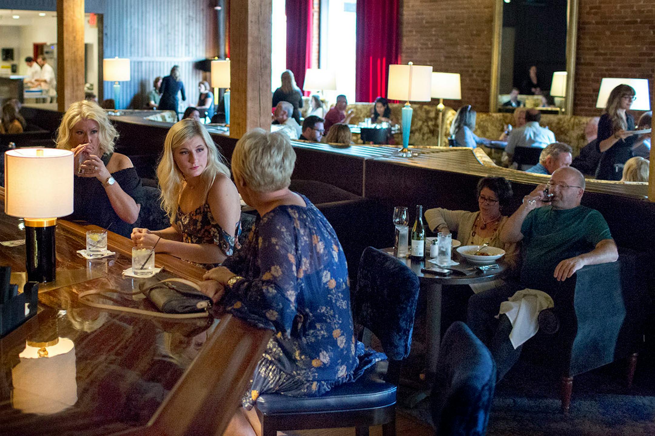 People sit in the bar at Lovechild. ] COURTNEY PEDROZA • courtney.pedroza@startribune.com June 22-24, 2017; Wisconsin restaurants, cafes, bars, bakeries and breweries; Dining along the Mississippi River.
