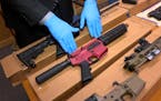 Ghost guns —  the untraceable, build-it-yourself weaponry — are displayed at the headquarters of the San Francisco Police Department in 2019.