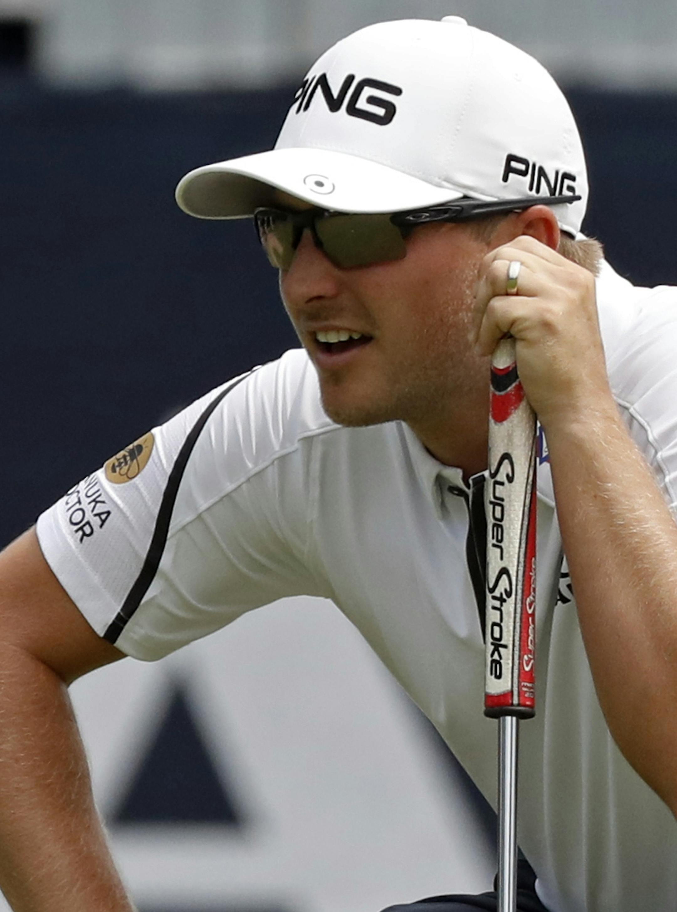 Austin Cook looks at a putt on the 18th green during the first round of the PGA Championship golf tournament at Bellerive Country Club, Thursday, Aug. 9, 2018, in St. Louis. (AP Photo/Brynn Anderson)